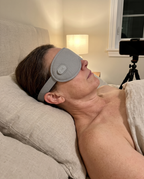 Woman wearing the grey eye mask during an evening routine