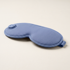 Side profile showing the depth and adjustable strap of the blue eye mask
